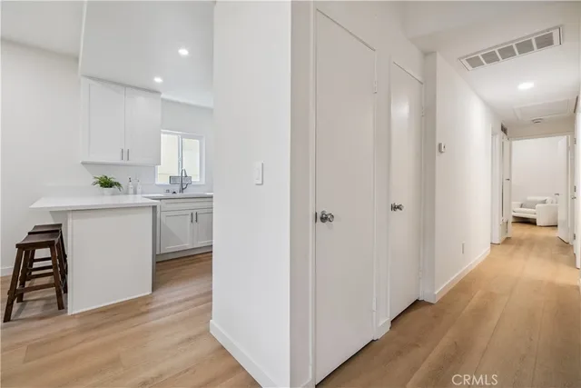 a view of a kitchen from the hallway