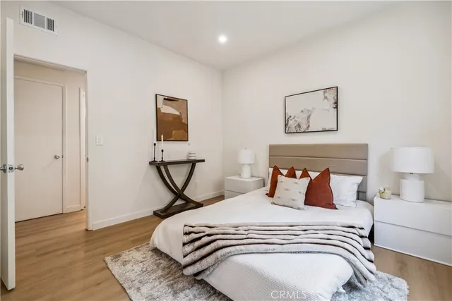 a bedroom with a bed and a table