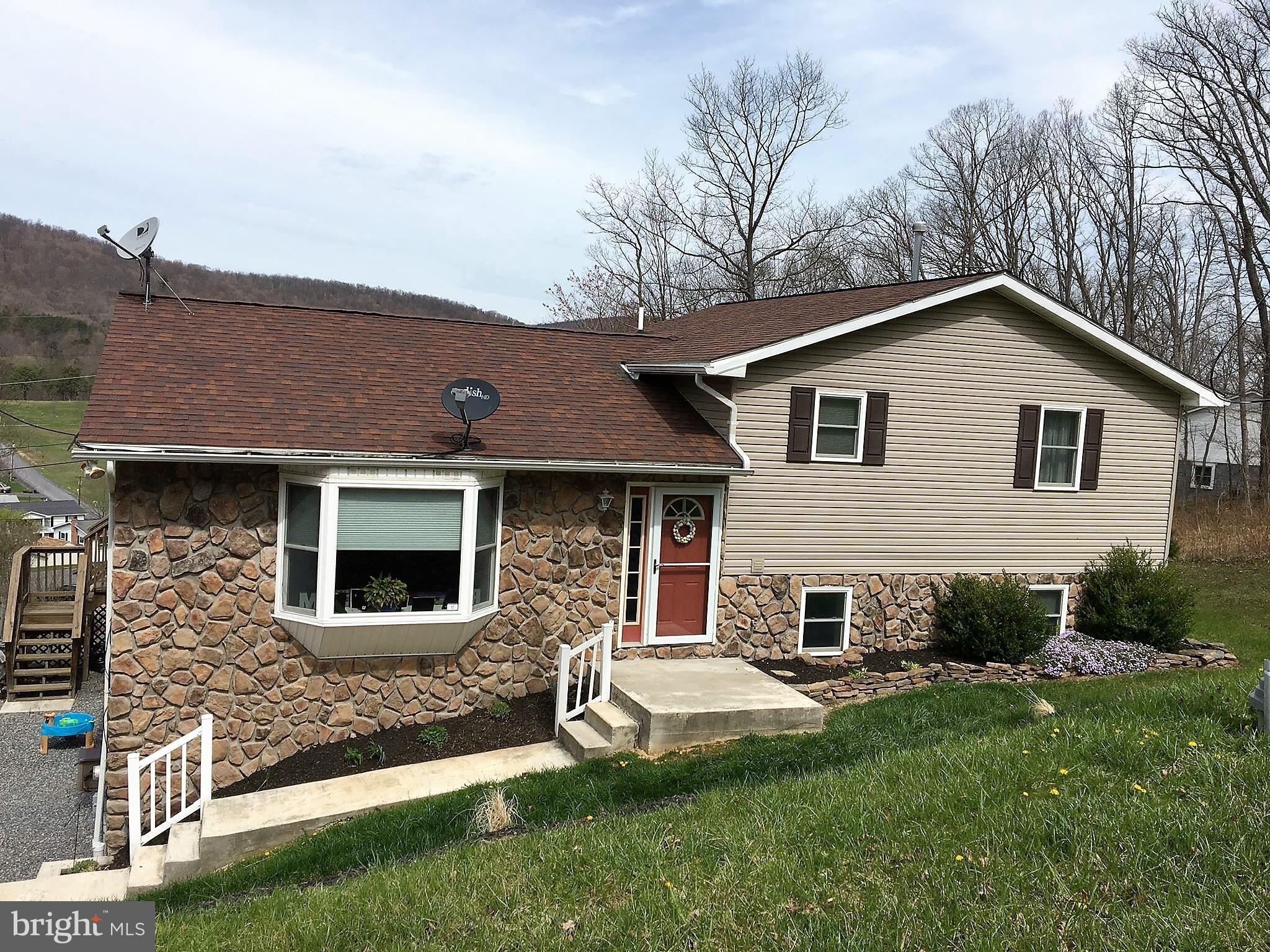 11705 Stoneleigh Road La Vale, MD 21502 - Photo 1 of 13 a front view of a house with a yard