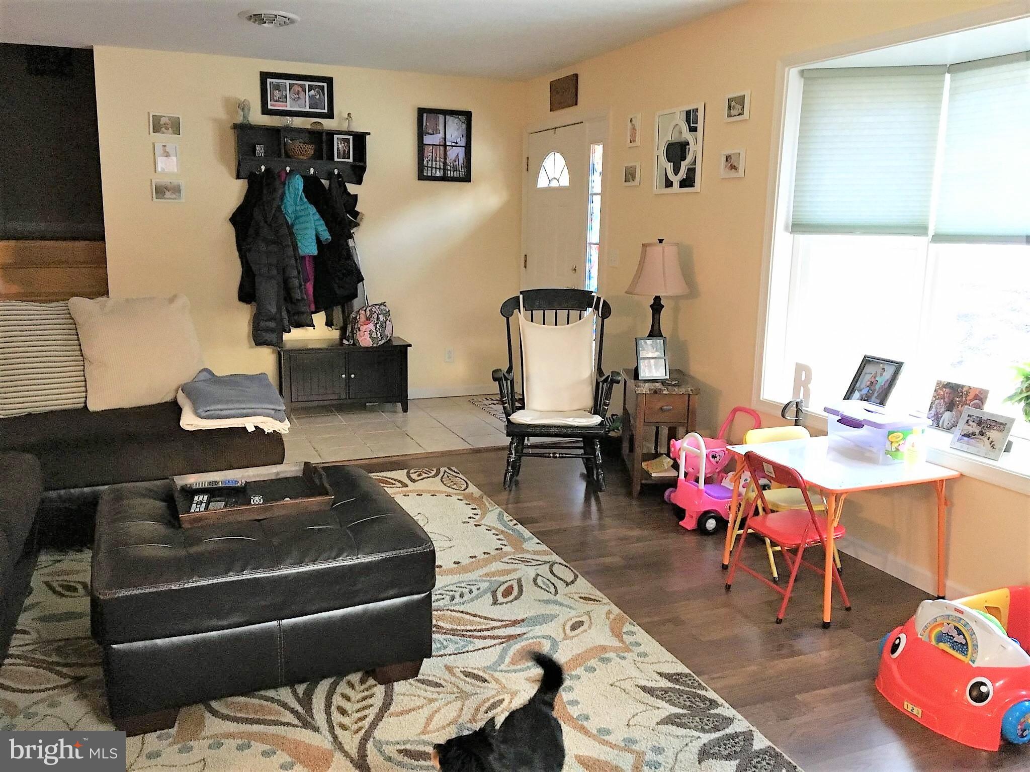 11705 Stoneleigh Road La Vale, MD 21502 - Photo 2 of 13 a living room with furniture and wooden floor