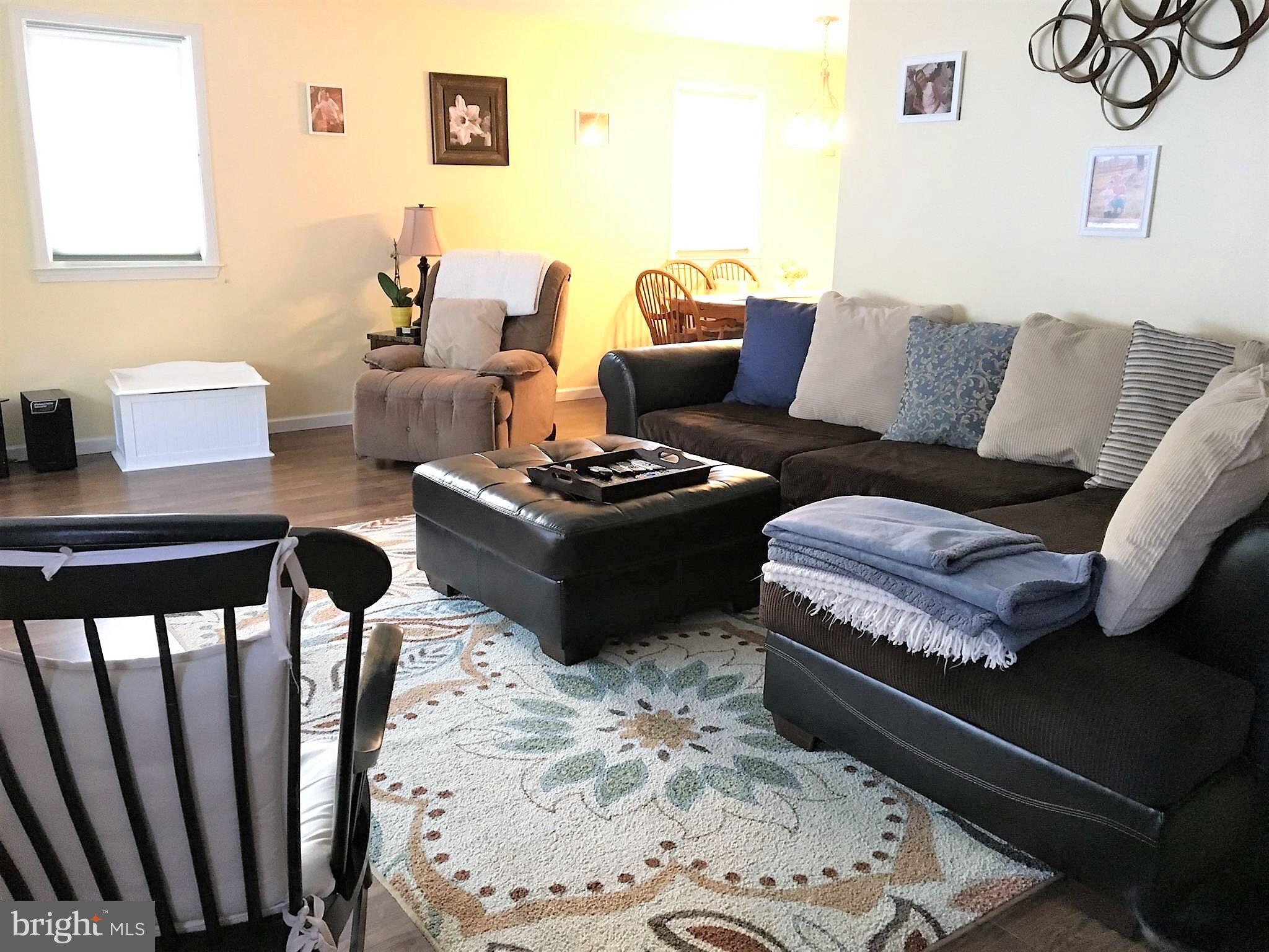 11705 Stoneleigh Road La Vale, MD 21502 - Photo 3 of 13 a living room with furniture and wooden floor