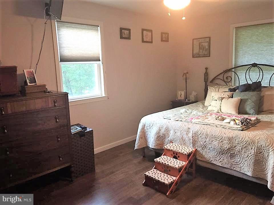 11705 Stoneleigh Road La Vale, MD 21502 - Photo 6 of 13 a bedroom with a bed and window
