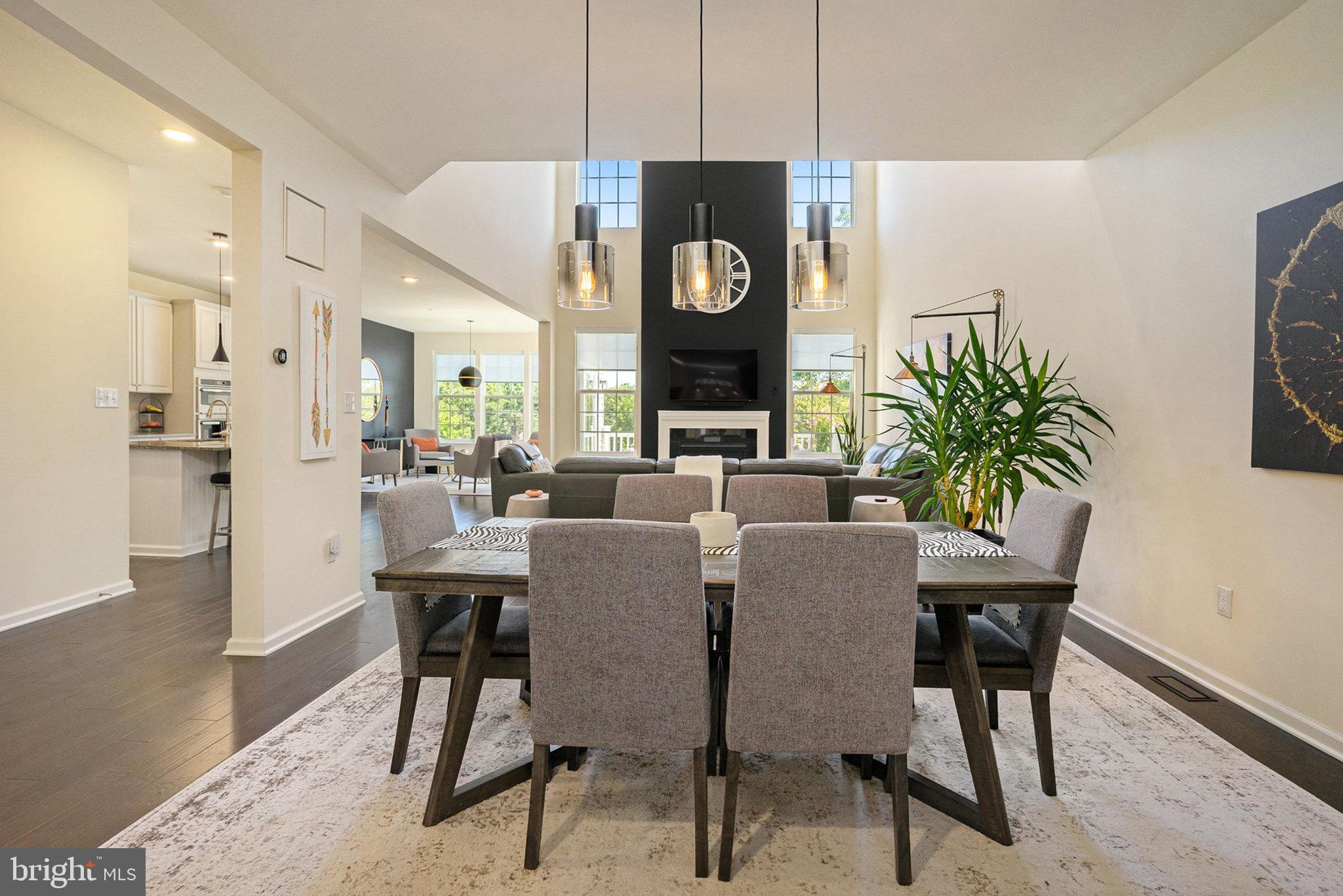 421 Lee Place Exton, PA 19341 - Photo 4 of 58 a dining room with furniture potted plants and wooden floor