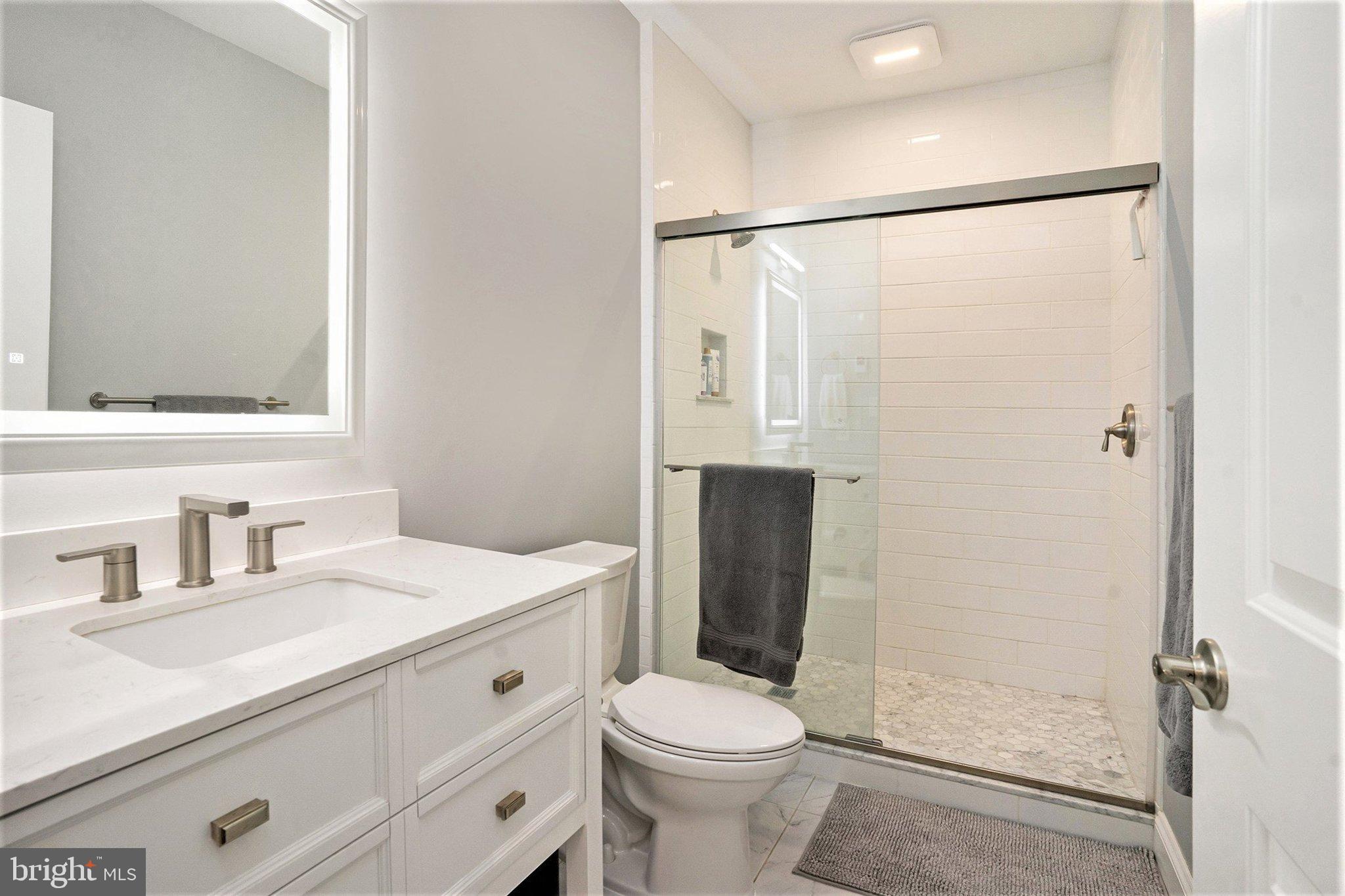 421 Lee Place Exton, PA 19341 - Photo 44 of 58 a bathroom with a sink toilet and shower