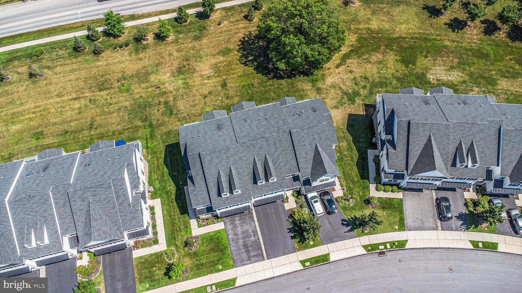421 Lee Place Exton, PA 19341 - Photo 46 of 58 an aerial view of a house with garden space and parking
