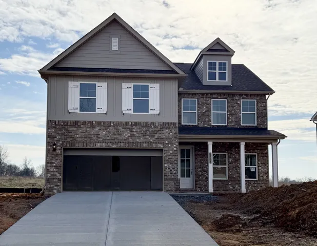 a front view of a house with yard