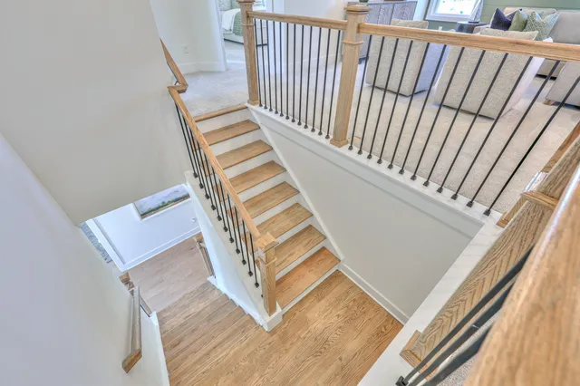 a living room with furniture and a lamp