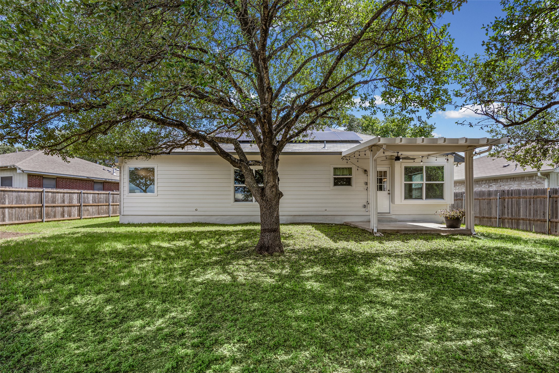 1524 Lochaline Loop Pflugerville, TX 78660 - Photo 22 of 22 A private backyard oasis features a shaded patio, perfect for relaxing.