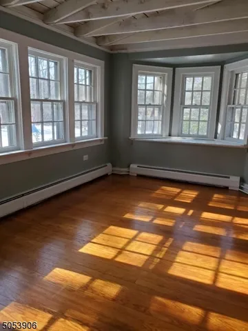 a view of empty room with windows