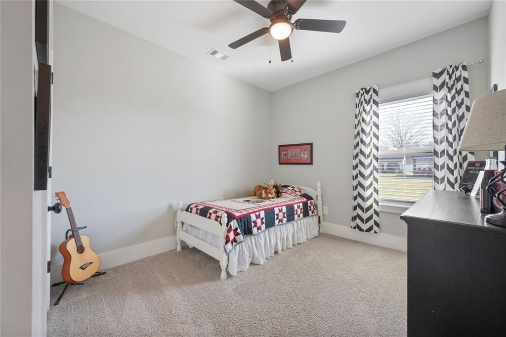 11700 Wildcat Bridge Road Danielsville, GA 30633 - Photo 28 of 49 a bedroom with a bed and a window