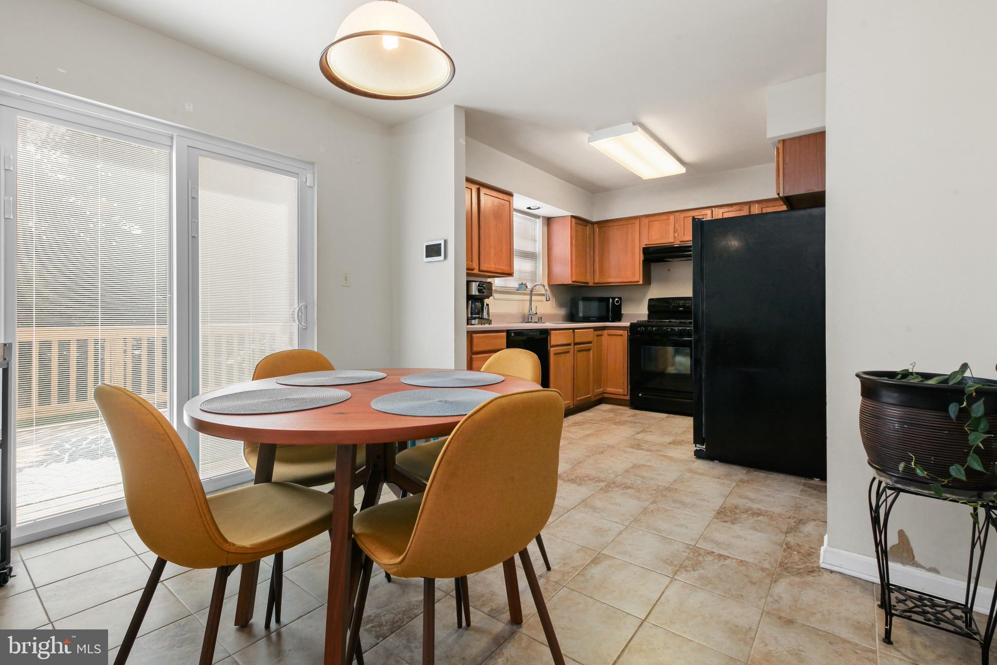 15 Tameron Place Rosedale, MD 21237 - Photo 15 of 38 a view of a dining room with furniture and a large window