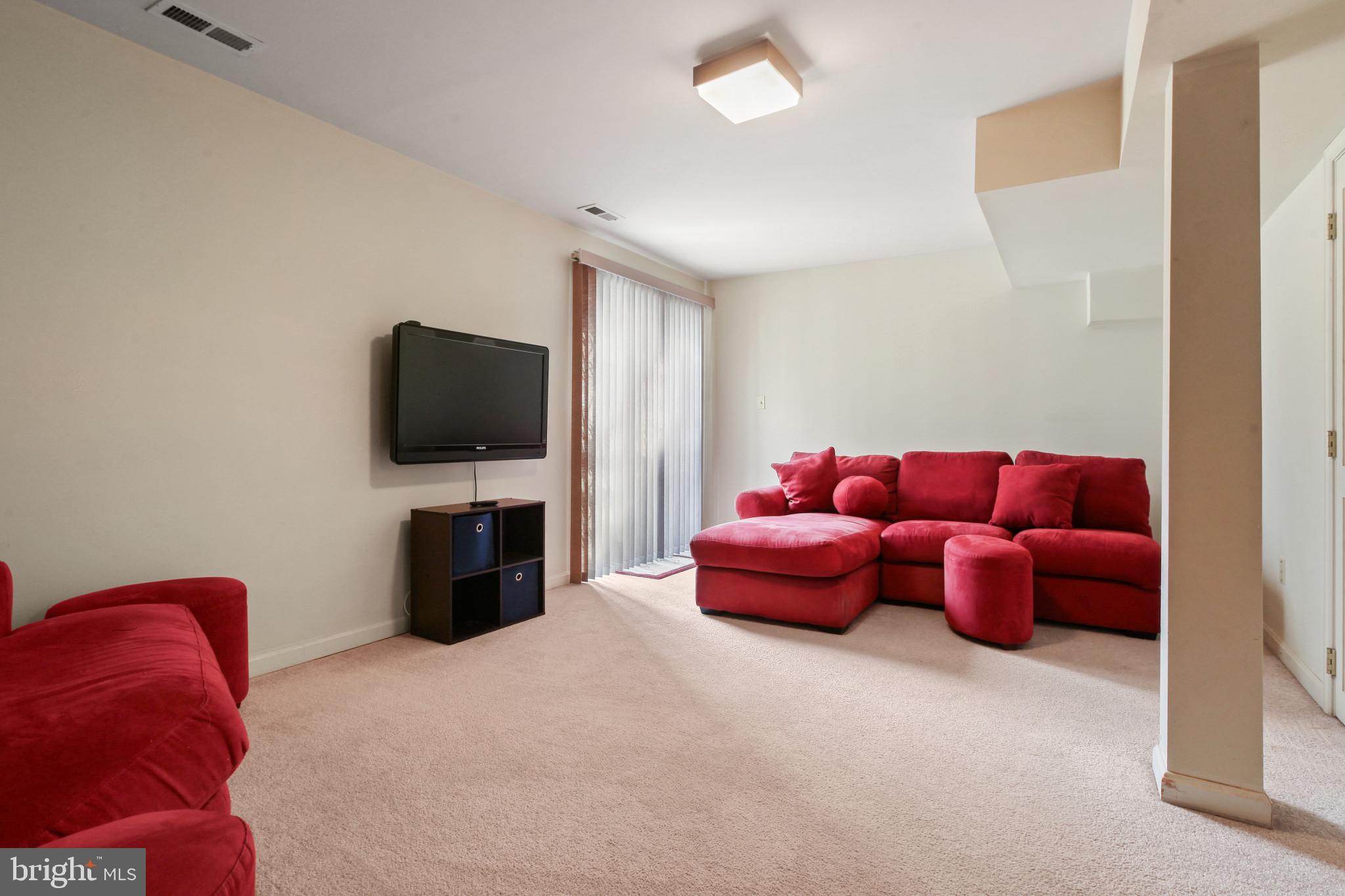 15 Tameron Place Rosedale, MD 21237 - Photo 24 of 38 a living room with furniture and a flat screen tv