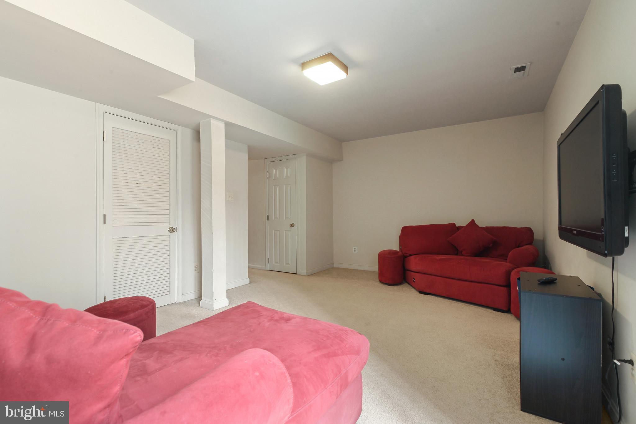 15 Tameron Place Rosedale, MD 21237 - Photo 25 of 38 a bedroom with a bed and a flat screen tv