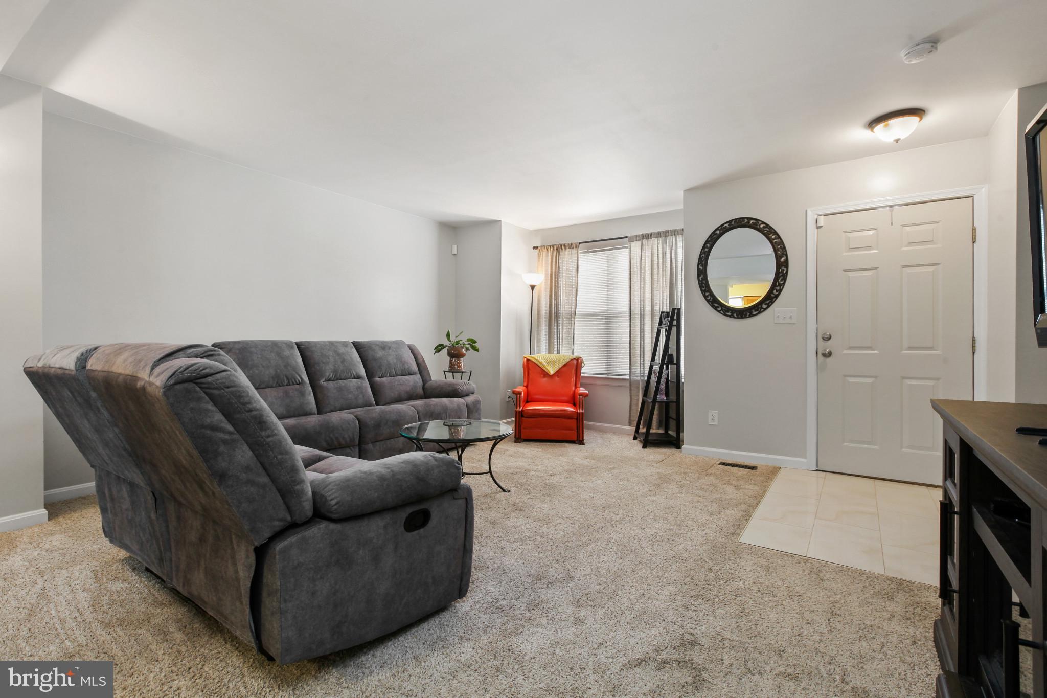 15 Tameron Place Rosedale, MD 21237 - Photo 5 of 38 a living room with furniture a mirror and a window