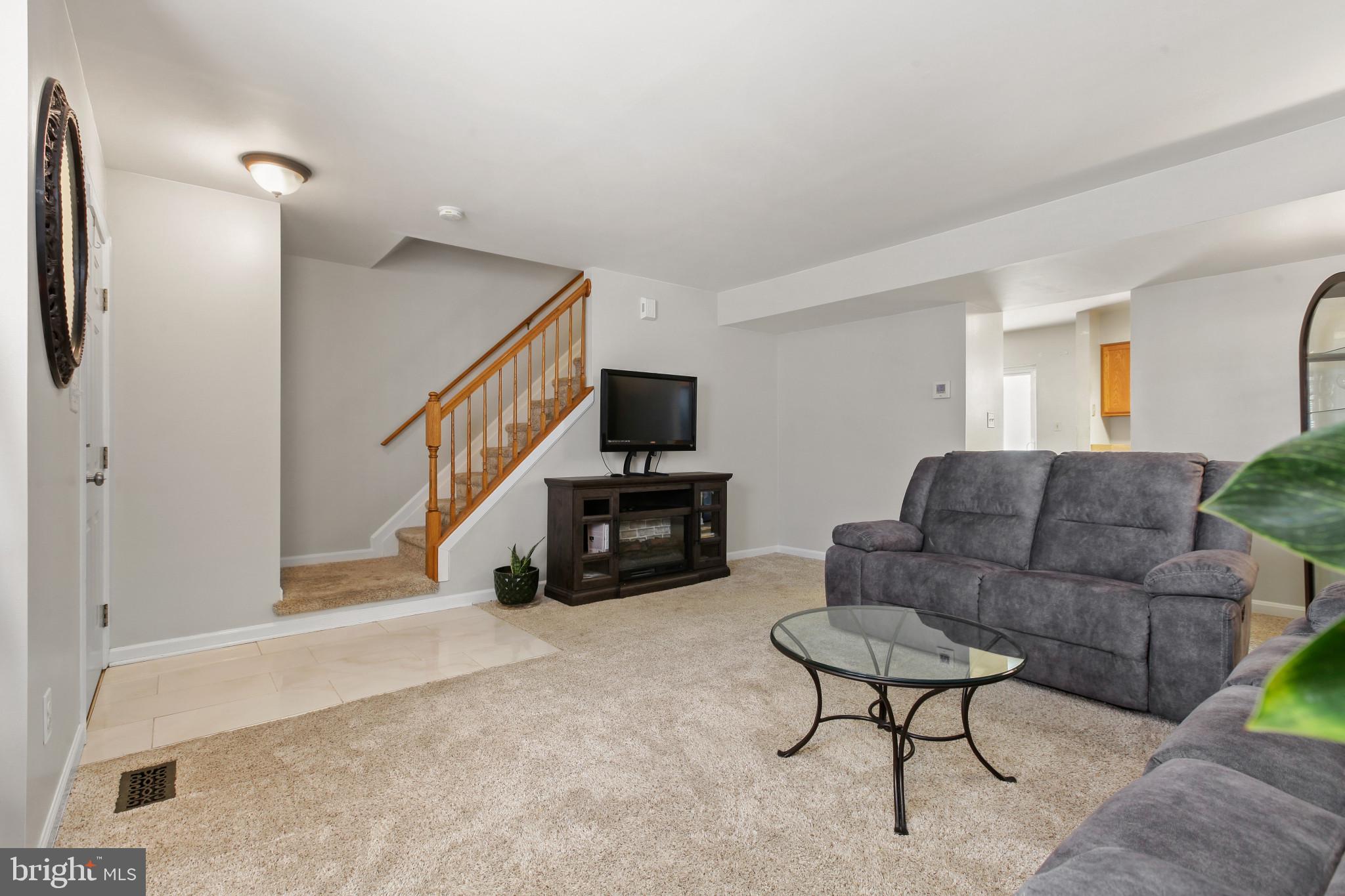 15 Tameron Place Rosedale, MD 21237 - Photo 6 of 38 a living room with furniture and a fireplace