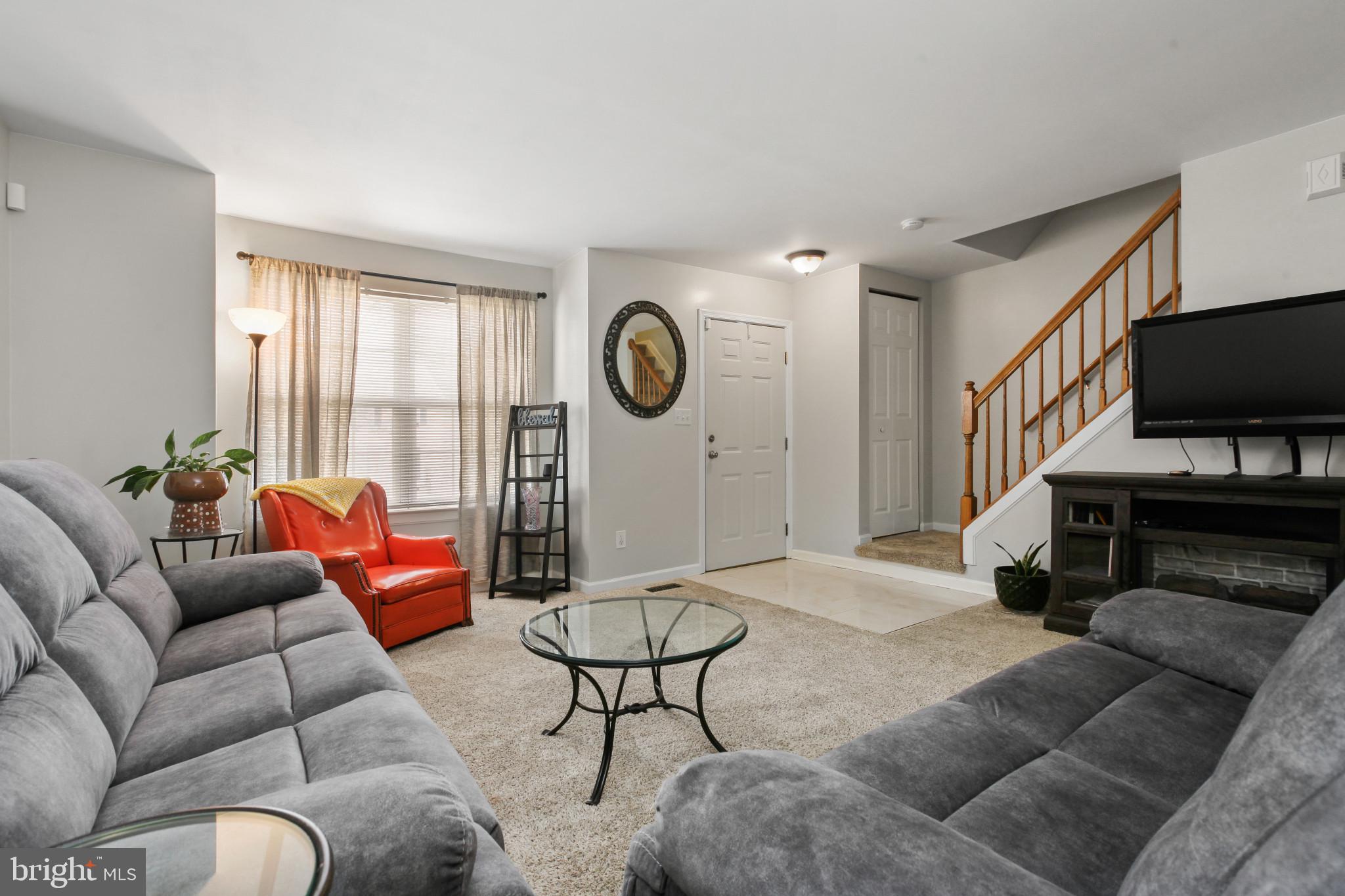 15 Tameron Place Rosedale, MD 21237 - Photo 8 of 38 a living room with furniture a flat screen tv and a window