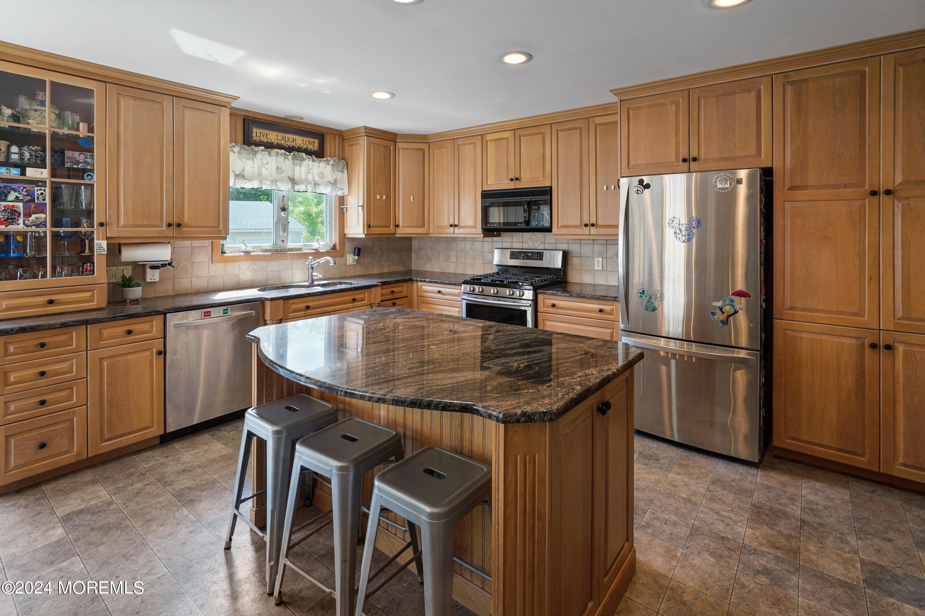 403 Union Lane Brielle, NJ 08730 - Photo 23 of 31 a kitchen with granite countertop a center island stainless steel appliances cabinets and a window