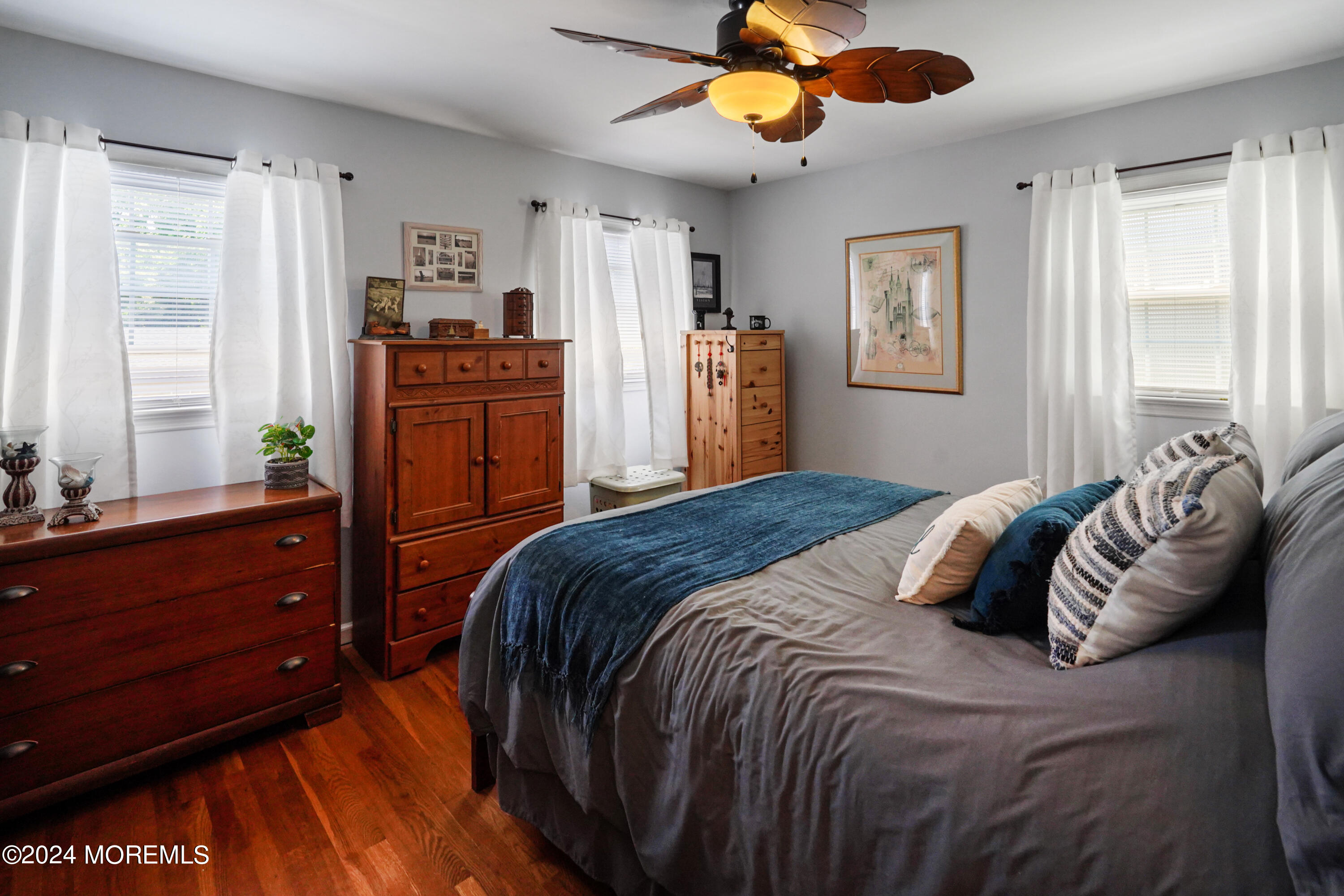 403 Union Lane Brielle, NJ 08730 - Photo 26 of 31 a bedroom with a bed and wooden floor
