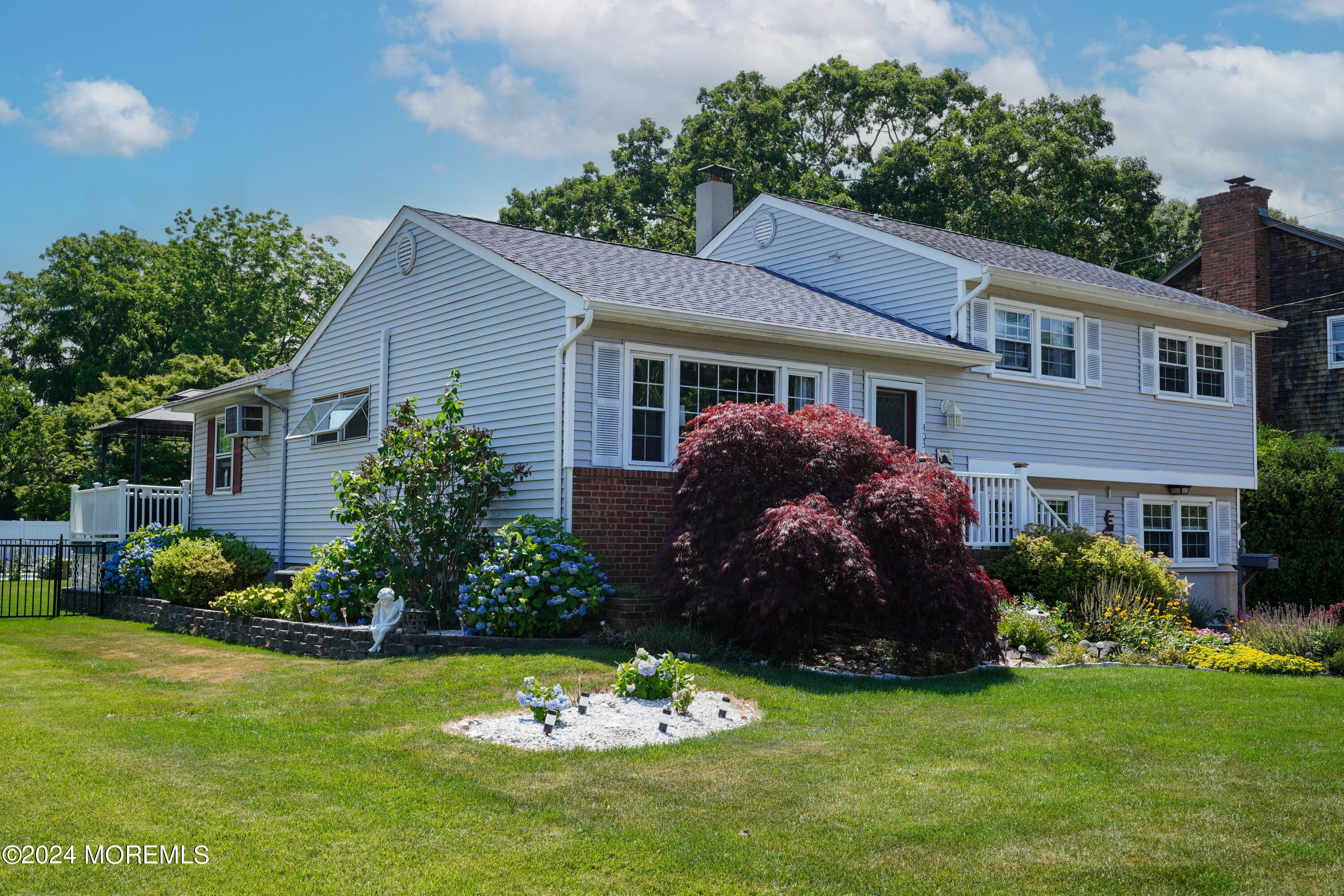 403 Union Lane Brielle, NJ 08730 - Photo 4 of 31 a view of a house with a yard and plants