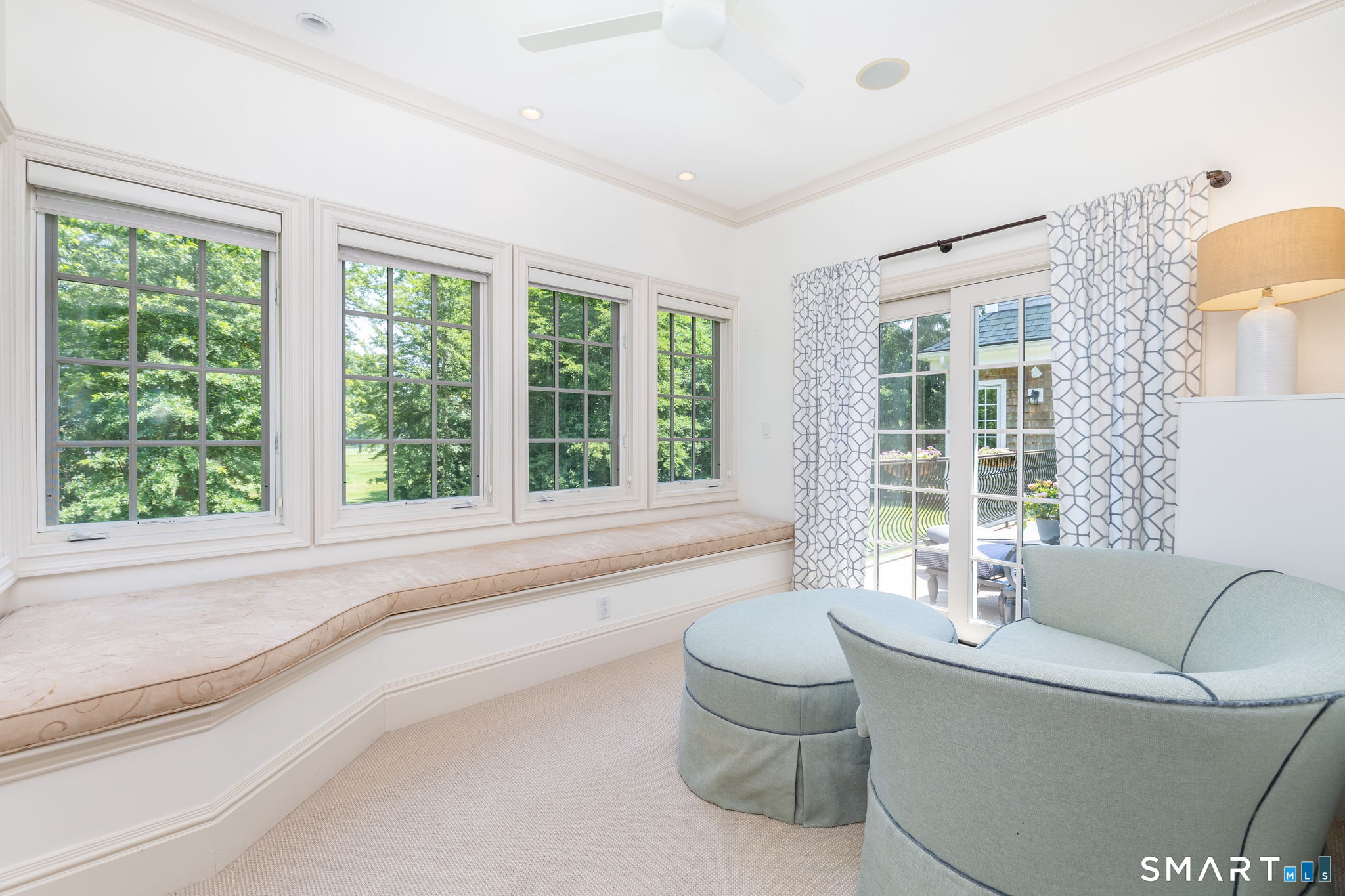 82 Ledyard Road West Hartford, CT 06117 - Photo 21 of 40 Sitting room in the primary bedroom suite has golf course views and access to the deck
