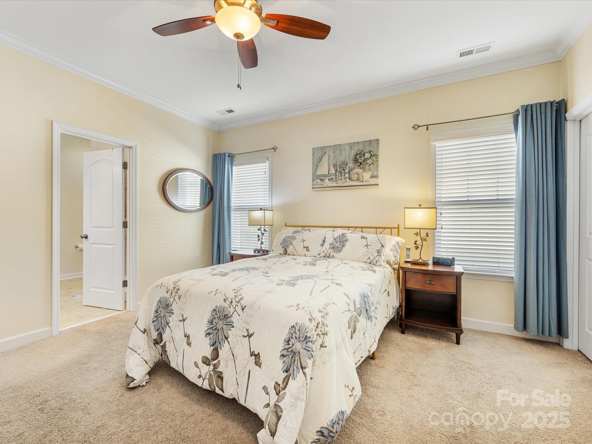 4434 Patriots Hill Road Mint Hill, NC 28227 - Photo 13 of 31 a bedroom with a bed and a chandelier