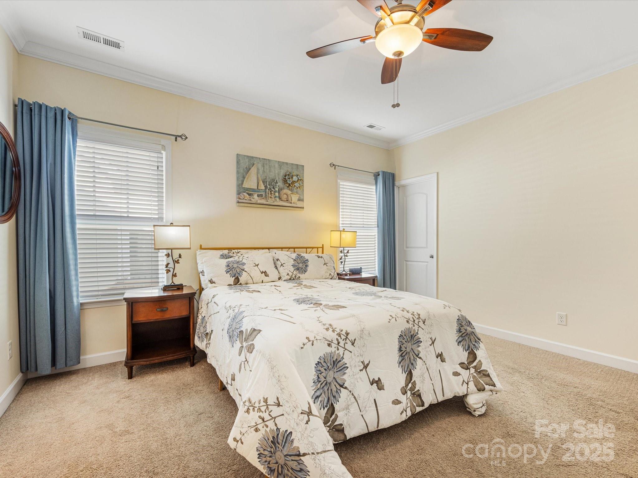4434 Patriots Hill Road Mint Hill, NC 28227 - Photo 14 of 31 a bedroom with a bed and a chandelier