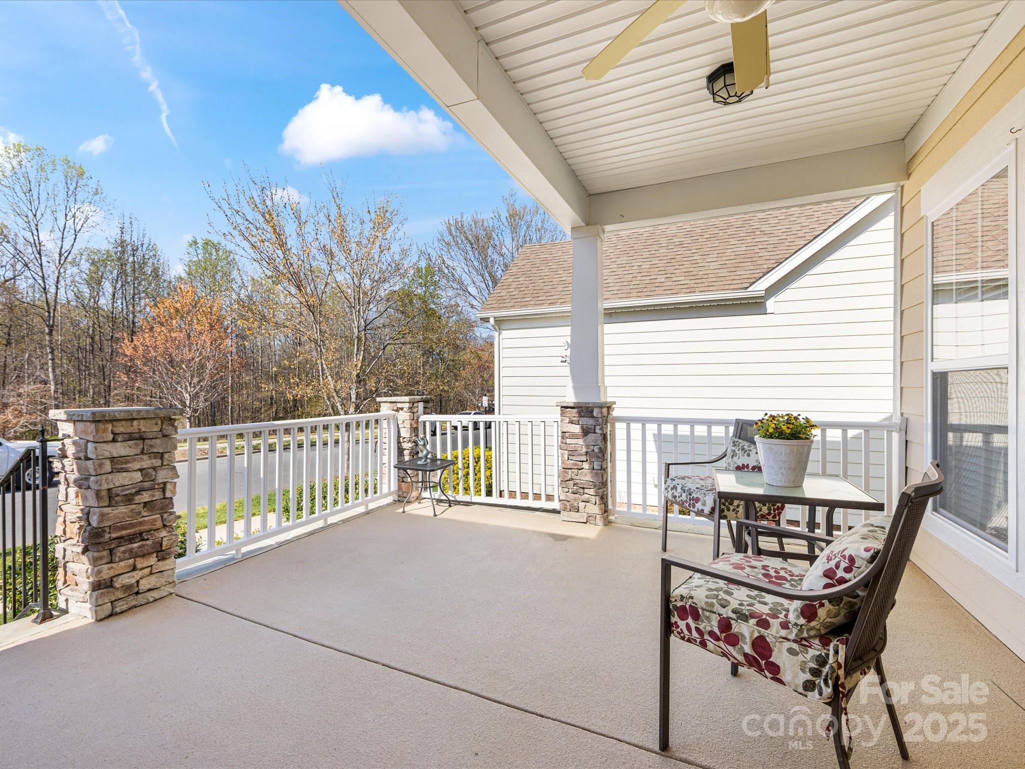4434 Patriots Hill Road Mint Hill, NC 28227 - Photo 24 of 31 a balcony with table and chairs