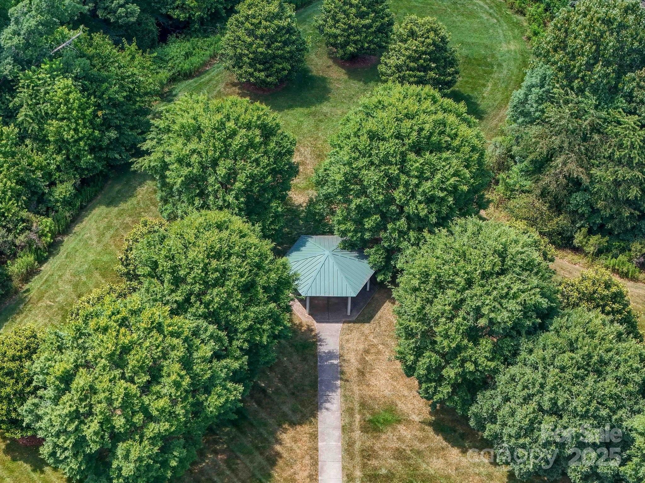 4434 Patriots Hill Road Mint Hill, NC 28227 - Photo 28 of 31 a view of a garden with a fountain
