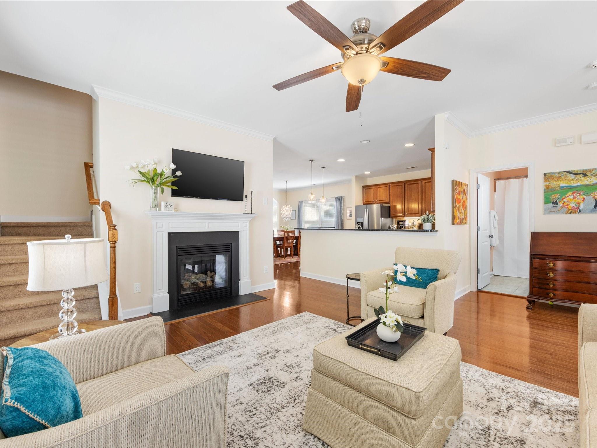 4434 Patriots Hill Road Mint Hill, NC 28227 - Photo 5 of 31 a living room with furniture and a fireplace
