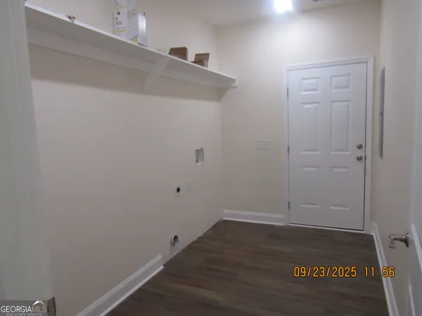 a view of small space with wooden floor