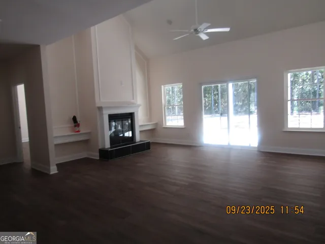 a living room with furniture window and fireplace