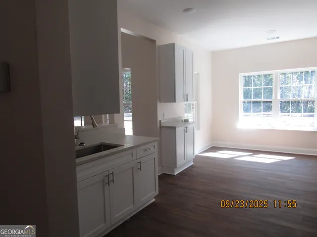 a view of a bathroom with dual sinks