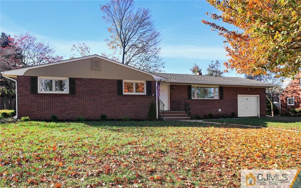 4 Carpender Road New Brunswick, NJ 08901 - Photo 1 of 21 a front view of a house with a garden