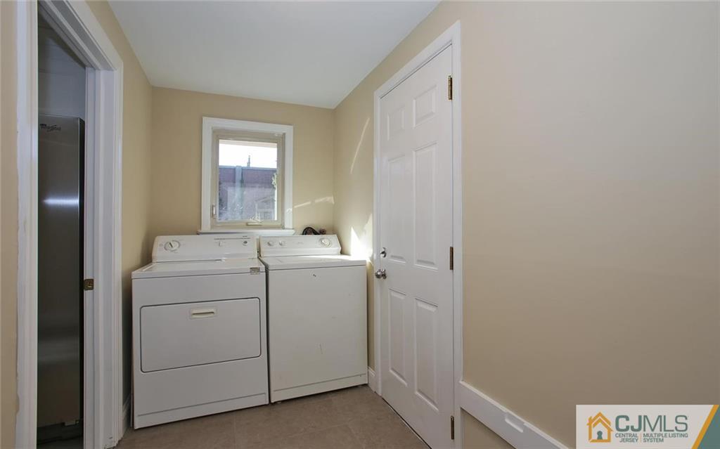 4 Carpender Road New Brunswick, NJ 08901 - Photo 11 of 21 a utility room with dryer and washer