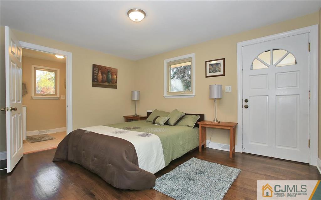 4 Carpender Road New Brunswick, NJ 08901 - Photo 14 of 21 a bedroom with a bed and wooden floor