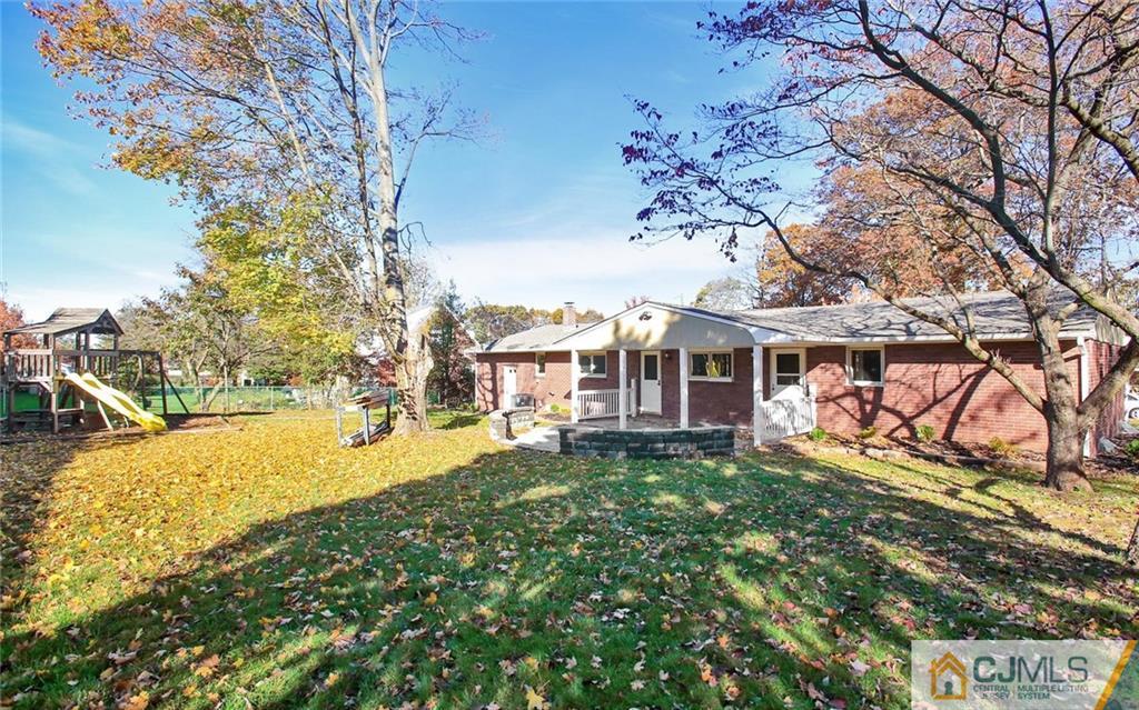4 Carpender Road New Brunswick, NJ 08901 - Photo 17 of 21 a view of a house with a big yard and large trees
