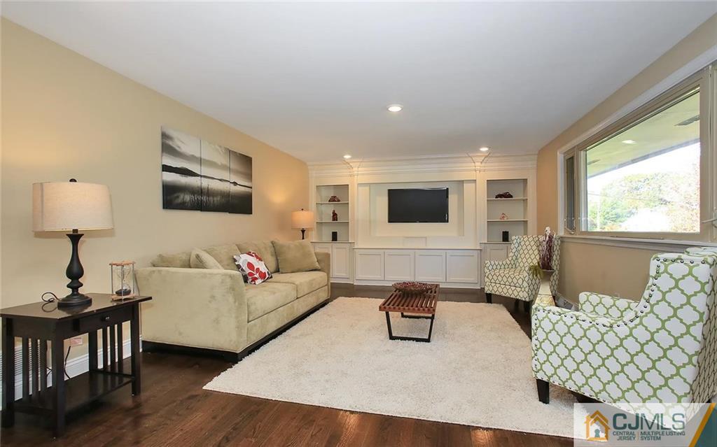 4 Carpender Road New Brunswick, NJ 08901 - Photo 4 of 21 a living room with furniture and a flat screen tv