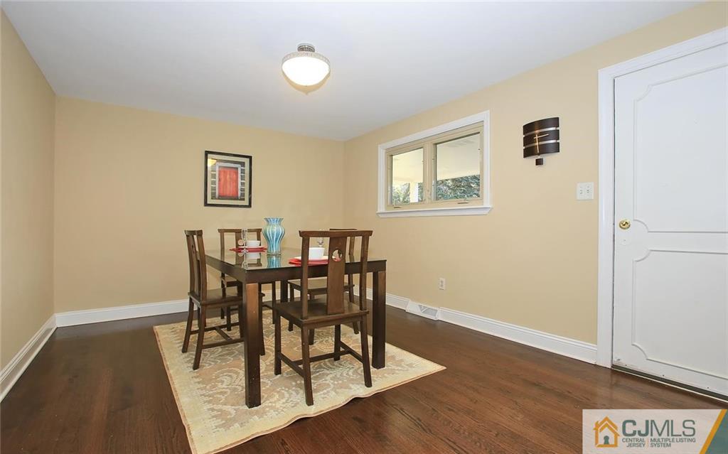 4 Carpender Road New Brunswick, NJ 08901 - Photo 6 of 21 a view of a dining room with furniture and wooden floor