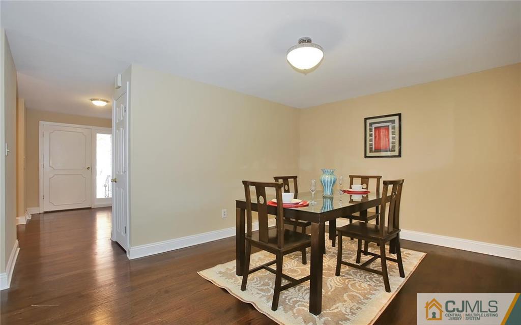 4 Carpender Road New Brunswick, NJ 08901 - Photo 7 of 21 a view of a dining room with furniture and wooden floor