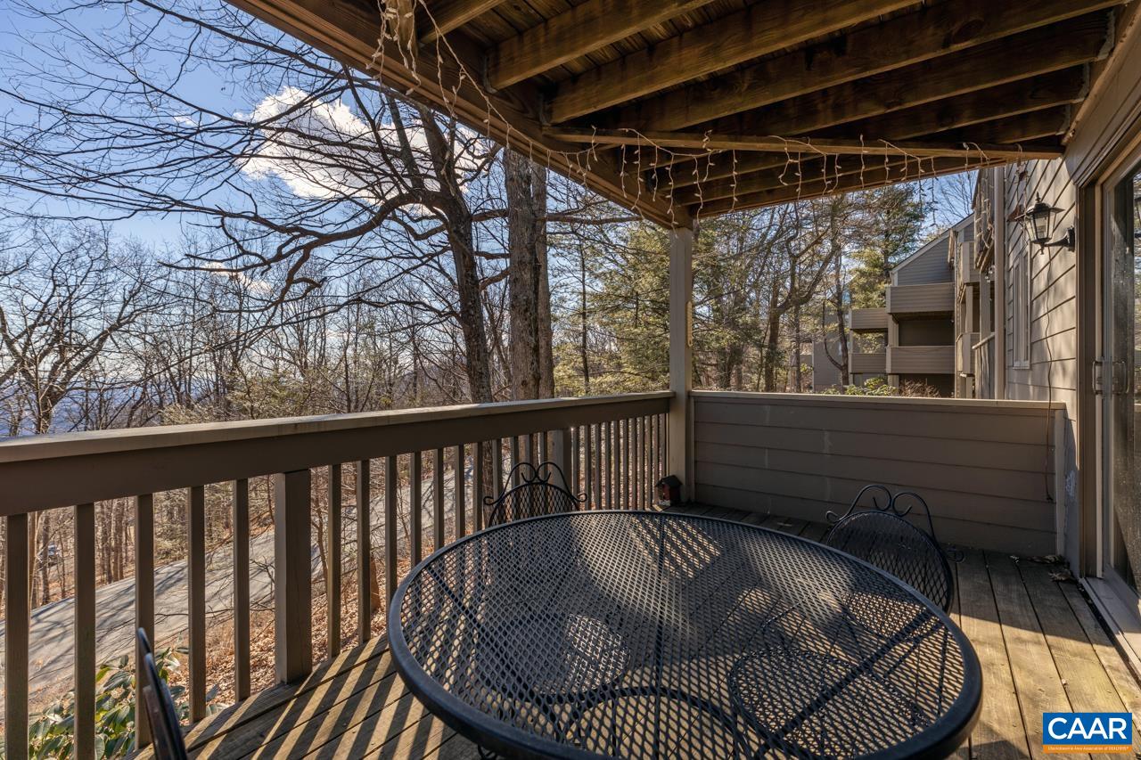 a view of balcony with furniture