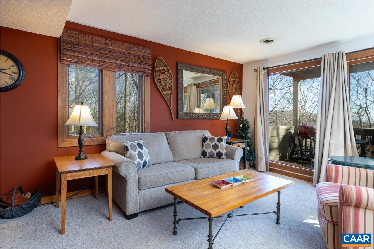 420 3 Ridges Wintergreen, VA 22967 - Photo 8 of 16 a living room with furniture a table and a large window