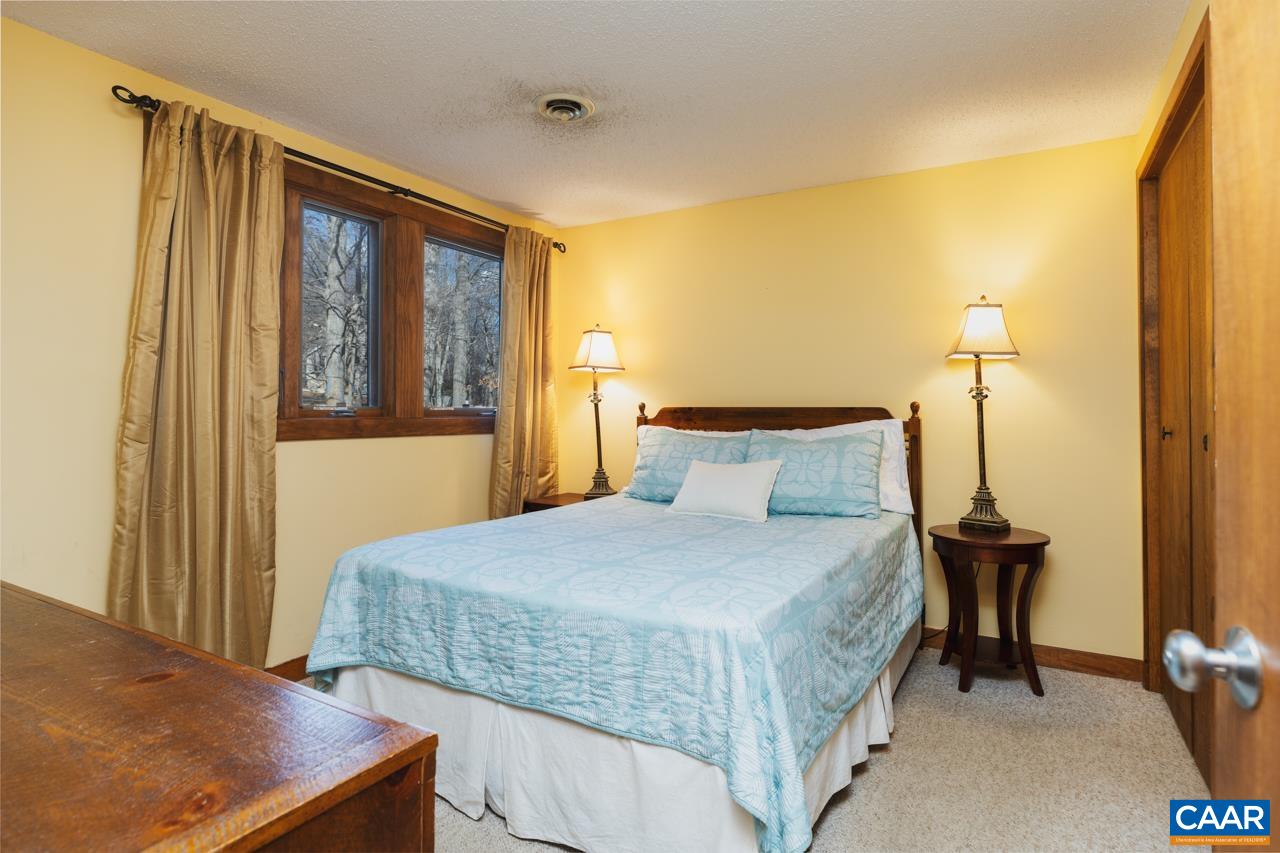 420 3 Ridges Wintergreen, VA 22967 - Photo 10 of 16 a bedroom with a bed and wooden floor