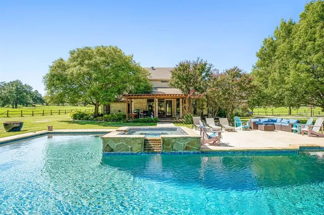 a view of a swimming pool with a patio