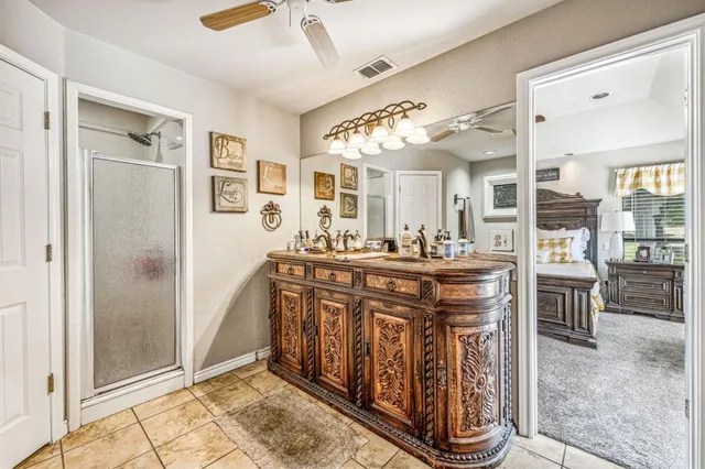 a bathroom with a sink a mirror and a shower