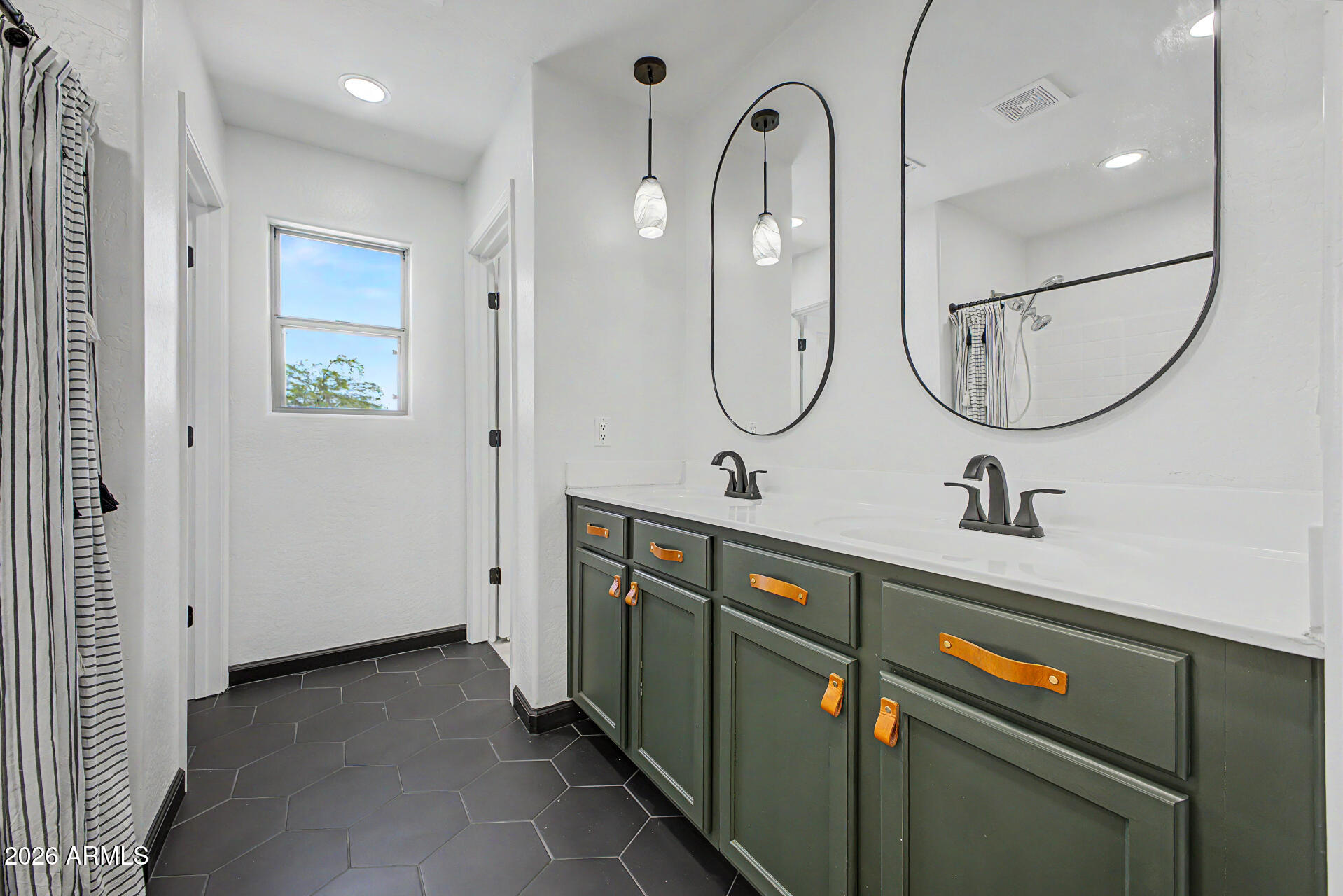 451 South Hawes Road, Unit 27 Mesa, AZ 85208 - Photo 15 of 27 a bathroom with a double vanity sink a toilet and a mirror