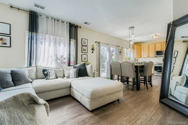a bedroom with a bed couch and a window