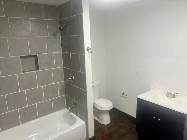 a white bath tub sitting next to a white toilet