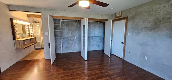 a bathroom with a double vanity sink and mirror