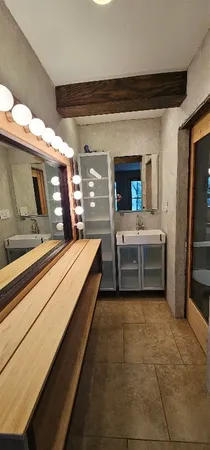 a bathroom with a shower and a toilet