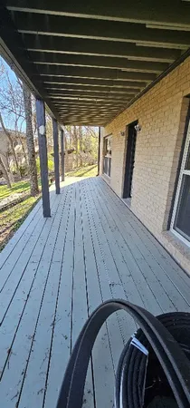 a view of outdoor space with wooden floor